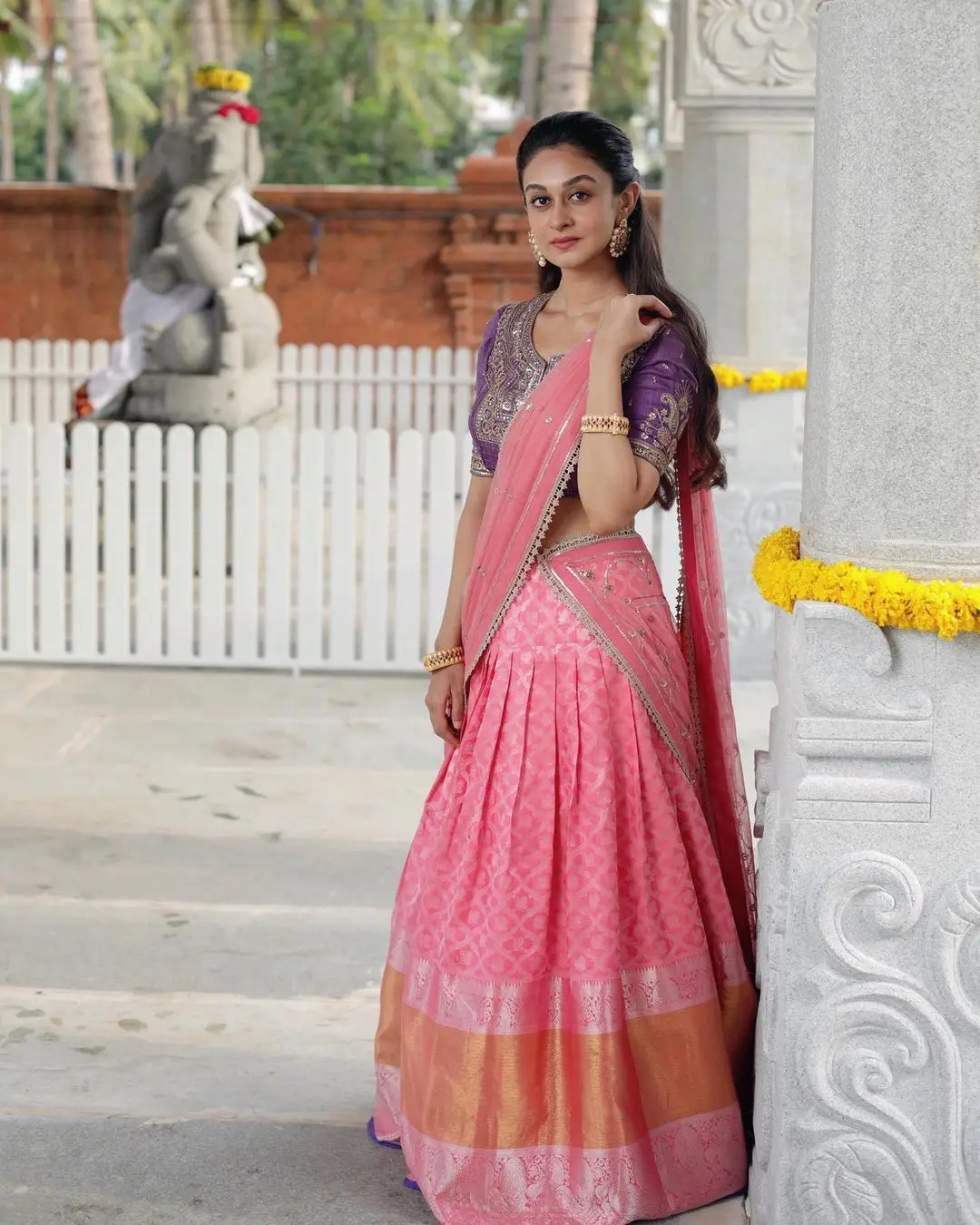 indian girl aishwarya arjun in traditional pink half saree blue blouse